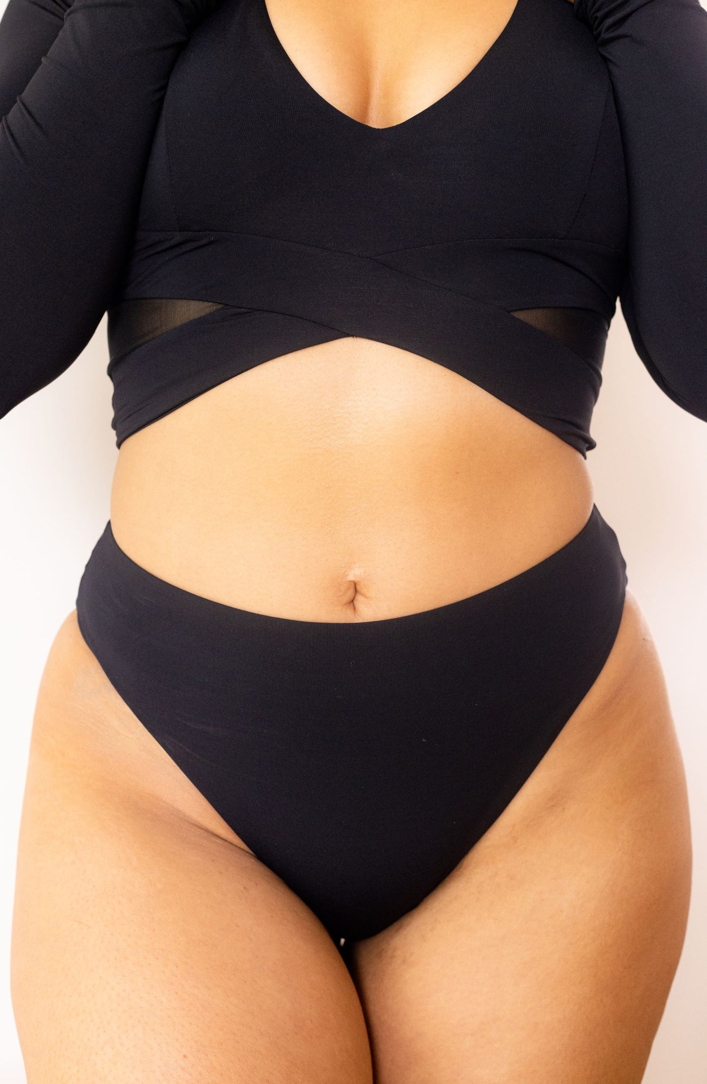 The Dip Rash Guard and The Dip bikini bottom in black close up